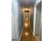 Hallway featuring hardwood floors leading to various rooms in the home at 4081 Jodeco Rd, Stockbridge, GA 30281