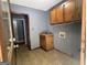 A laundry room featuring a sink and wood cabinets ready for washer and dryer at 4081 Jodeco Rd, Stockbridge, GA 30281