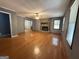 Spacious living room features hardwood floors, a stone fireplace, ceiling fan and neutral paint at 4081 Jodeco Rd, Stockbridge, GA 30281