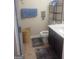 Cozy bathroom featuring a toilet, sink, and wicker basket for a comfortable design at 6153 Oakley Rd, Union City, GA 30291