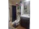 Bathroom with a shower featuring a purple curtain, a sink, and storage shelves at 6153 Oakley Rd, Union City, GA 30291