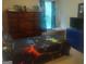 Bedroom with a black and blue video game themed bed and a large dresser for storage at 6153 Oakley Rd, Union City, GA 30291