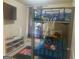 Fun bedroom with a bunk bed and a basketball hoop, providing a playful space at 6153 Oakley Rd, Union City, GA 30291