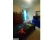 Bedroom featuring a bed with an entertainment-themed print on the bedding at 6153 Oakley Rd, Union City, GA 30291