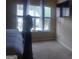Bedroom featuring bright windows, neutral walls, and carpeted floors at 6153 Oakley Rd, Union City, GA 30291