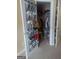 Walk-in closet with door shoe organizer and shelving for ample storage space at 6153 Oakley Rd, Union City, GA 30291