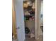 Linen closet overflowing with clothes and items; open door at 6153 Oakley Rd, Union City, GA 30291