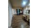 Large dining room with hardwood floors, a kitchen bar, and open concept layout at 6153 Oakley Rd, Union City, GA 30291