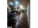 Open concept home with dark brown cabinets, hardwood floors, and an island at 6153 Oakley Rd, Union City, GA 30291
