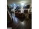 Open-concept living area featuring sleek floors, modern decor, and seamless flow to the kitchen at 6153 Oakley Rd, Union City, GA 30291