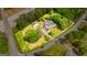 An aerial view showing the property lines of a home surrounded by trees and adjacent to a highway at 26 Cannongate Rd, Sharpsburg, GA 30277