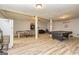Spacious basement featuring a ping pong table, pool table, and neutral paint with laminate flooring at 26 Cannongate Rd, Sharpsburg, GA 30277