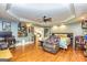 Spacious bedroom featuring hardwood floors, custom decor, and ample seating at 26 Cannongate Rd, Sharpsburg, GA 30277