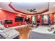 Spacious bedroom with hardwood floors, ceiling fan, large windows, and lounge area with gray couch at 26 Cannongate Rd, Sharpsburg, GA 30277