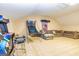 Fun bonus room features vintage arcade game, basketball game, stools, and comfortable couch at 26 Cannongate Rd, Sharpsburg, GA 30277