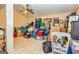 A room cluttered with boxes and stored items, illuminated by a ceiling light at 26 Cannongate Rd, Sharpsburg, GA 30277