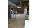 Unfinished basement with concrete floor, exposed ceiling, and a workbench against the back wall at 4616 Hamlet Se Walk, Conyers, GA 30094