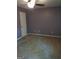 Cozy bedroom featuring soft carpeting, ample closet space, and overhead fan at 4616 Hamlet Se Walk, Conyers, GA 30094