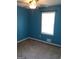 Bedroom features soft carpeting and a bright window with a fan overhead at 4616 Hamlet Se Walk, Conyers, GA 30094