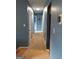 Hallway with blue walls and white trim leading to bedrooms at 4616 Hamlet Se Walk, Conyers, GA 30094