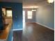 Inviting living room with hard wood floors that leads into a dining area and a kitchen at 4616 Hamlet Se Walk, Conyers, GA 30094