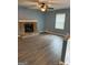 Living room features fireplace and wood flooring at 4616 Hamlet Se Walk, Conyers, GA 30094