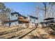 A spacious backyard with a retaining wall and lush green grass at 1620 Saddle Ridge Way, Sandy Springs, GA 30350