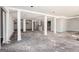 Unfinished basement with white support columns and space for customization and renovation projects at 1620 Saddle Ridge Way, Sandy Springs, GA 30350