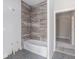 Bathroom with new tub, tiled wall and floor, awaiting finishing touches at 1620 Saddle Ridge Way, Sandy Springs, GA 30350