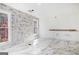 Bathroom featuring decorative wall tile and a view window at 1620 Saddle Ridge Way, Sandy Springs, GA 30350