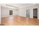 Spacious bedroom featuring hardwood floors, a tray ceiling, and natural light from two large windows at 1620 Saddle Ridge Way, Sandy Springs, GA 30350
