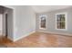 Bright bedroom with hardwood floors and dual windows offering natural light at 1620 Saddle Ridge Way, Sandy Springs, GA 30350