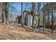 Exterior view of home featuring natural landscape, driveway, and a contemporary design at 1620 Saddle Ridge Way, Sandy Springs, GA 30350