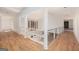 Bright, light-filled foyer featuring hardwood floors and contemporary metal railing providing views to the outdoors at 1620 Saddle Ridge Way, Sandy Springs, GA 30350