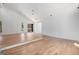 Open-concept living room featuring hardwood floors, high ceilings, and view windows at 1620 Saddle Ridge Way, Sandy Springs, GA 30350