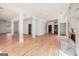 Spacious living area with marble fireplace, hardwood floors, white walls, and ample natural light at 1620 Saddle Ridge Way, Sandy Springs, GA 30350