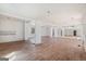 Expansive living room featuring hardwood floors, white walls, and natural light streaming through a window at 1620 Saddle Ridge Way, Sandy Springs, GA 30350