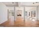Bright living room with marble fireplace, hardwood floors, white walls, and glass doors at 1620 Saddle Ridge Way, Sandy Springs, GA 30350