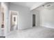 Light-filled room with multiple doorways, awaiting new flooring and customization at 1620 Saddle Ridge Way, Sandy Springs, GA 30350