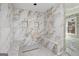 New shower with hexagon tiling, marble walls, and built-in bench at 1620 Saddle Ridge Way, Sandy Springs, GA 30350