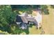 An aerial view shows a large backyard and the home's roof at 1231 Hillview Rd, Hampton, GA 30228