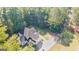 Aerial view of the home showing the long driveway and surrounding wooded areas at 1231 Hillview Rd, Hampton, GA 30228