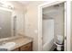 Bathroom with a single vanity, a separate toilet and a tub with shower at 1231 Hillview Rd, Hampton, GA 30228