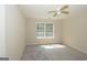 Bedroom featuring neutral colored walls, carpeted floors, a ceiling fan and a sunny window at 1231 Hillview Rd, Hampton, GA 30228