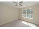 Bedroom featuring neutral colored walls, carpeted floors, a ceiling fan and a window at 1231 Hillview Rd, Hampton, GA 30228