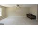Bedroom with neutral colored walls, carpeted floors, ceiling fan and chaise at 1231 Hillview Rd, Hampton, GA 30228