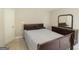 Bedroom featuring a wooden sleigh bed with dresser, and a light-colored door at 1231 Hillview Rd, Hampton, GA 30228