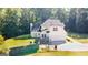Charming two-story home with a well-manicured lawn and attached two-car garage at 1231 Hillview Rd, Hampton, GA 30228