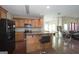 Functional kitchen with wood cabinets, breakfast bar, and modern appliances at 1231 Hillview Rd, Hampton, GA 30228