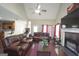 Inviting living room featuring a vaulted ceiling, fireplace, hardwood floors, comfortable seating, and lots of natural light at 1231 Hillview Rd, Hampton, GA 30228